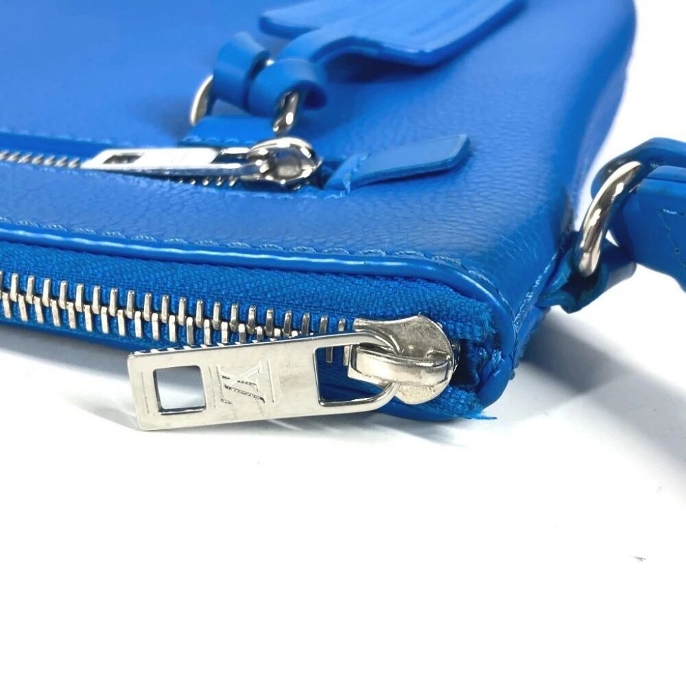 LOUIS VUITTON M82270 Aerogram Takeoff-Pouch Clutch (Initials "MH" on name tag) - Picture 9 of 15